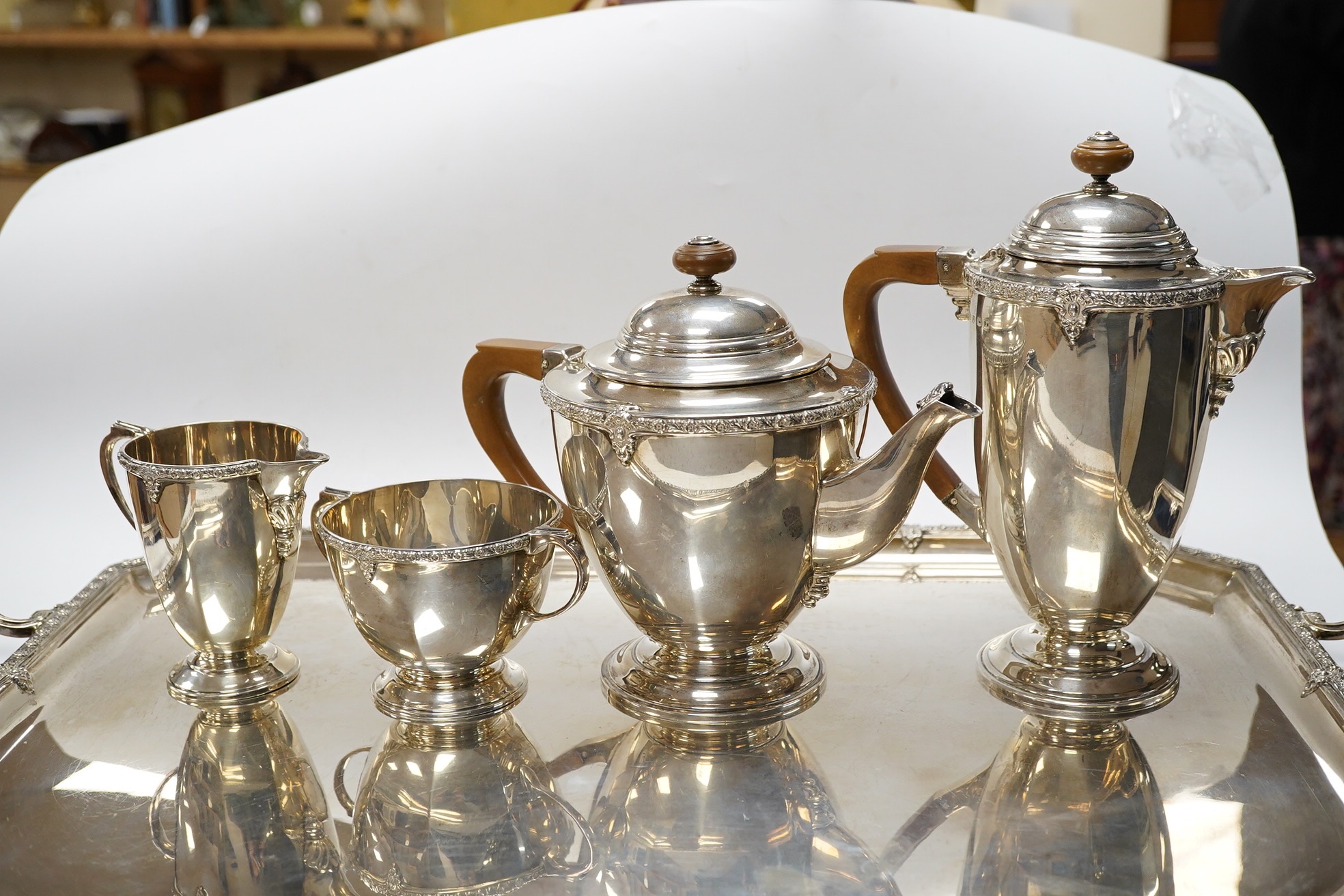 A George V silver five piece silver tea service including a two handled tea tray by Roberts & Belk, Sheffield, 1931/1934, tray 61.2cm over handles, gross weight 165.1oz. Condition - Fair to good